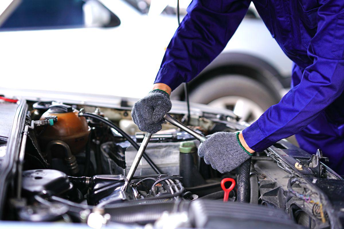 Mechanic working on engine bay