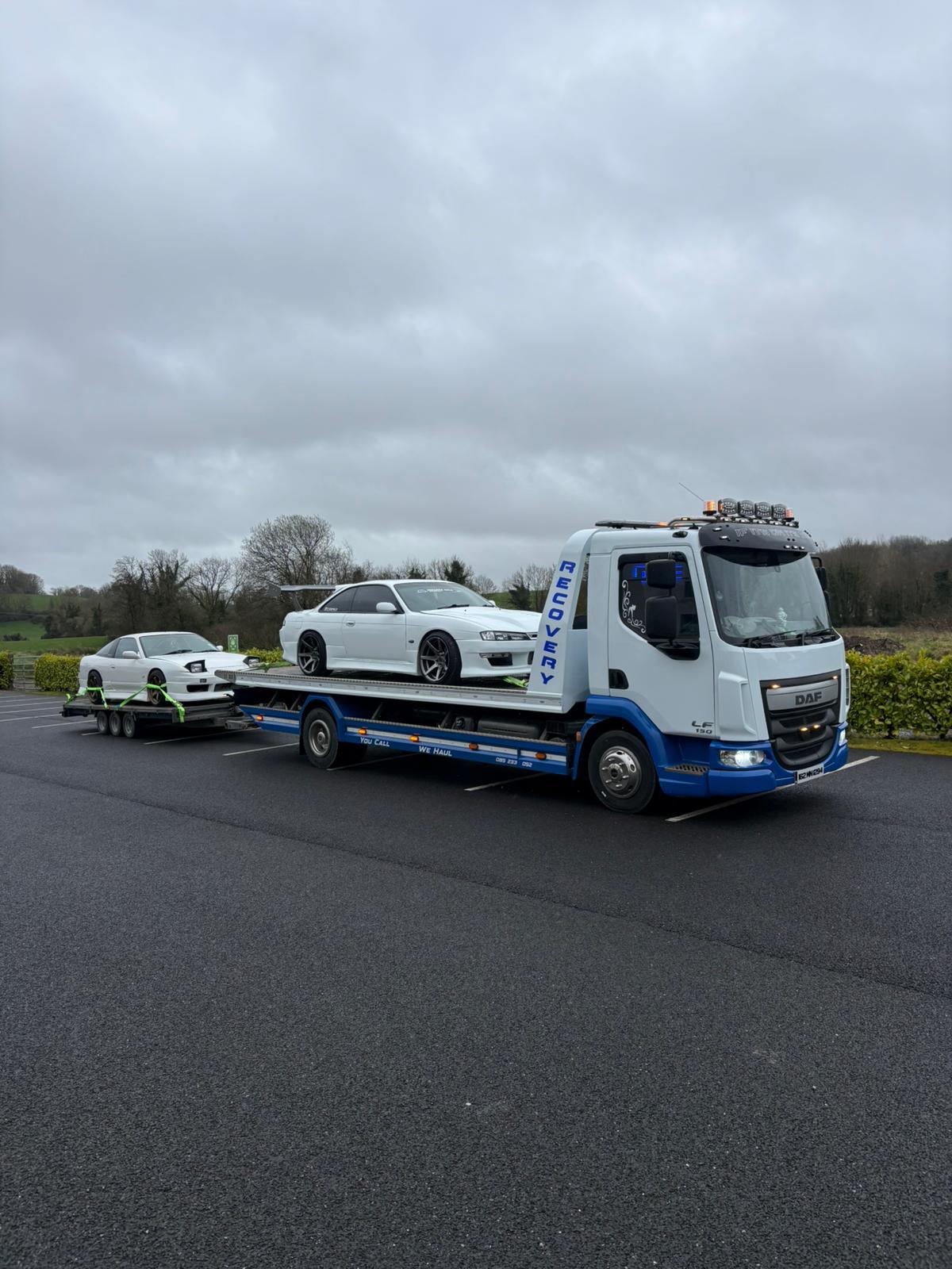 MD Recovery truck transporting vehicles